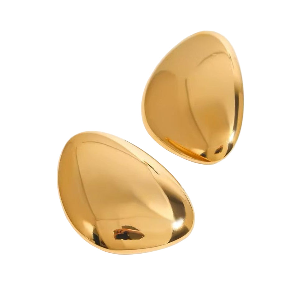 Pair of gold earrings on a white background