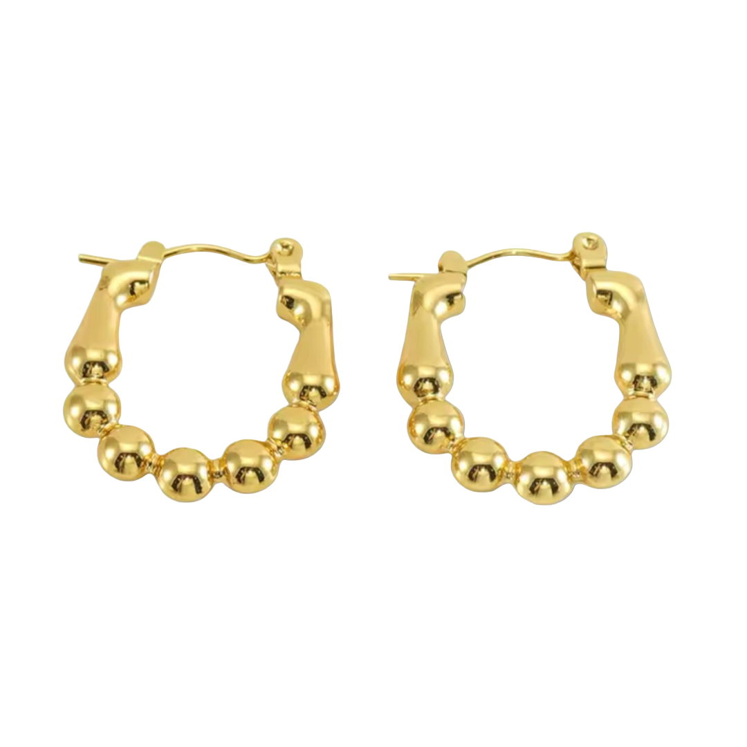 A pair of gold-colored Luxe Sphere Hoops crafted with high-quality materials displayed on white background.