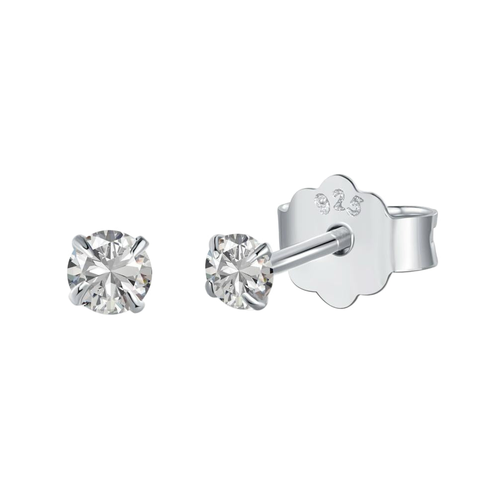 A pair of Luxe Stud Earrings with clear stones on a white background.