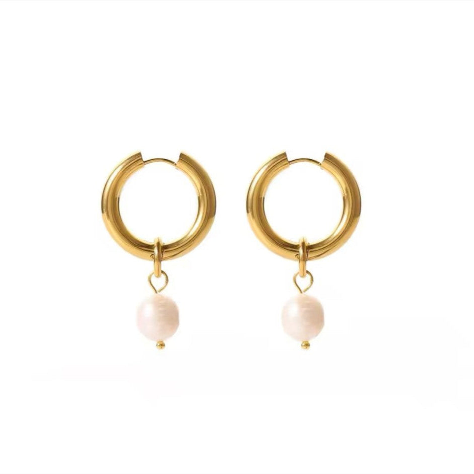 A pair of 18k gold plated stainless steel huggie earrings with freshwater pearl pendant.