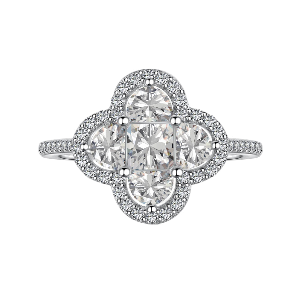 A silver clover-shaped ring with multiple clear gemstones and a rhodium plating.