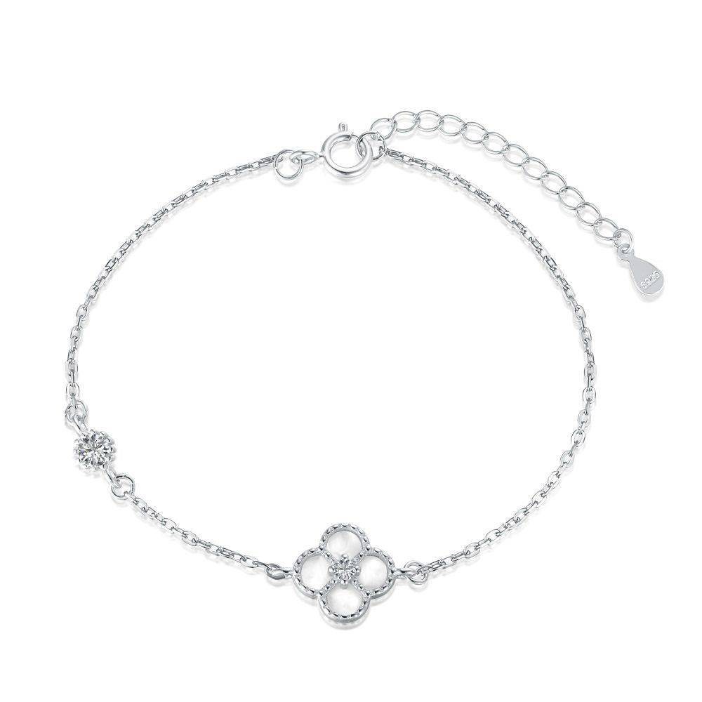 A sterling silver bracelet featuring a single flower-shaped pendant, with a chain-link design and a lobster clasp closure.