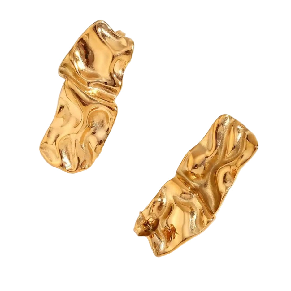 Gold earrings with a marble textured design on a white background