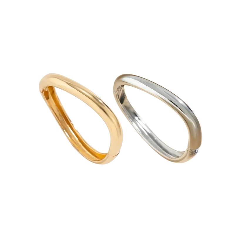 Gold and silver bracelet displayed against a white background.