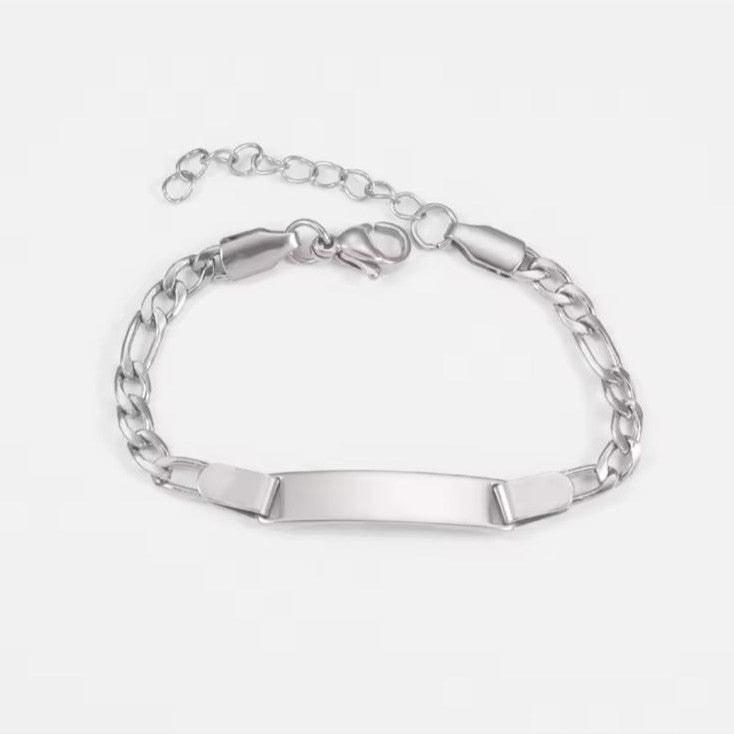 Silver bracelet with an engravable nameplate on a white background