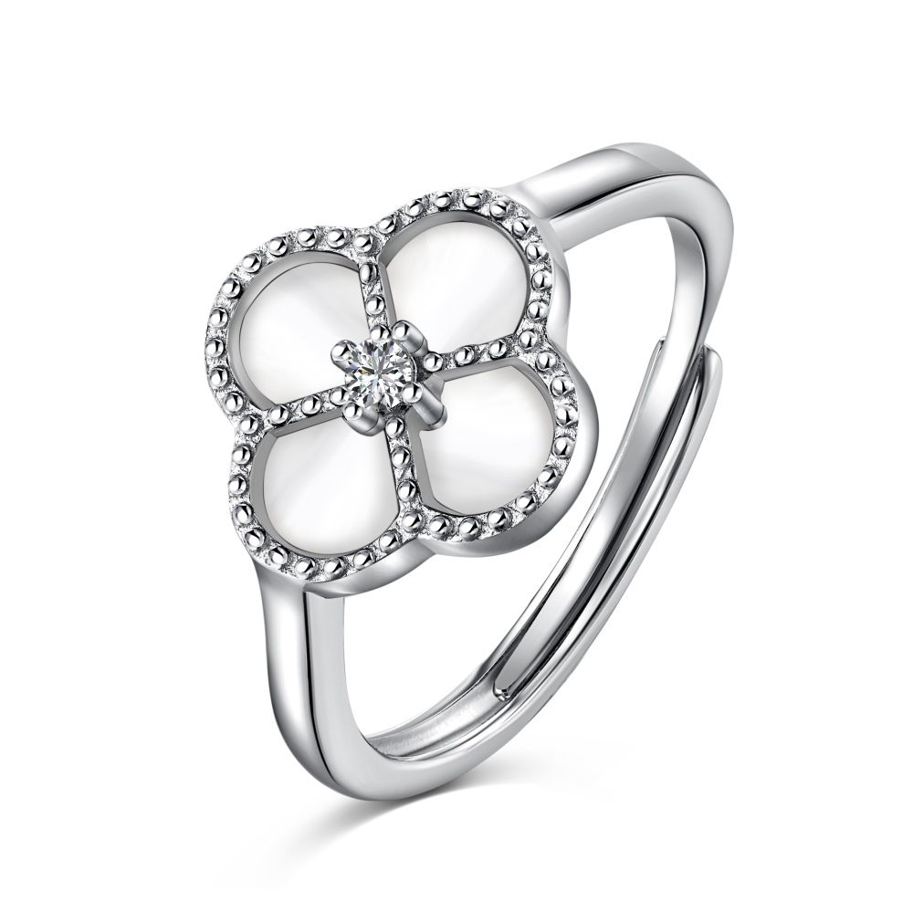 A sterling silver ring with a clover-shaped design, featuring a white zircon stone in the center, surrounded by a silver-colored band.
