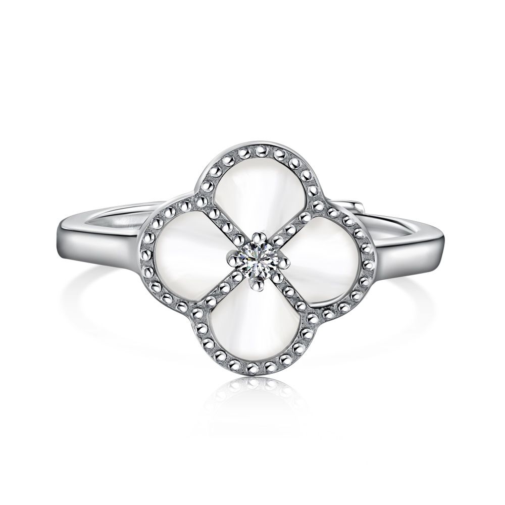 A sterling silver ring with a clover-shaped design, featuring a white zircon stone in the center, surrounded by a silver-colored band.
