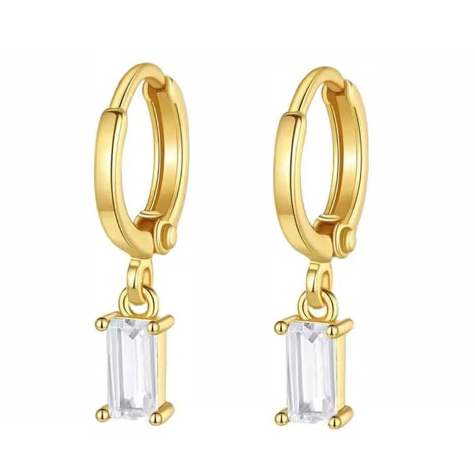 A pair of gold-colored stainless steel hoop earrings with a simple geometric drop design.