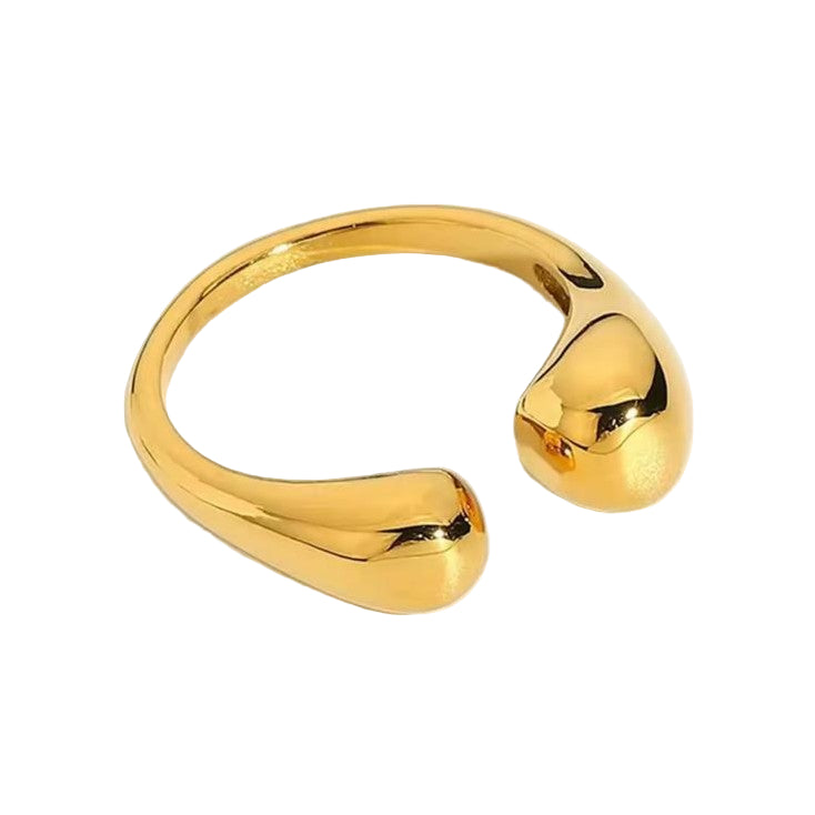 A irregular adjustable gold ring on a white background.