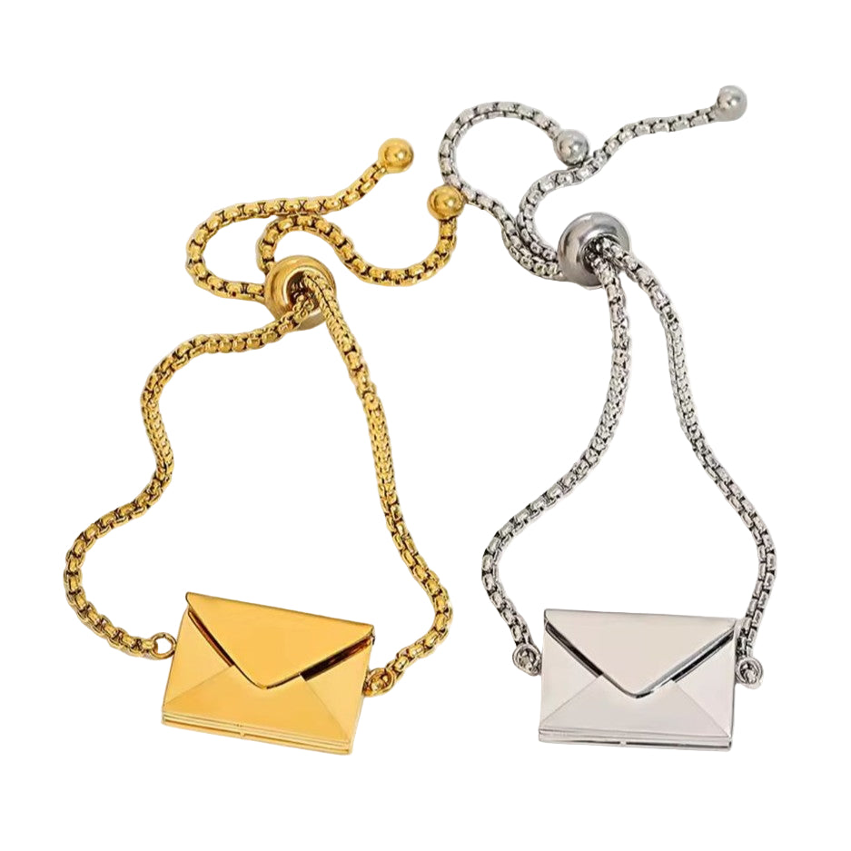 Gold and silver bracelets with engraved envelope charms on a white background