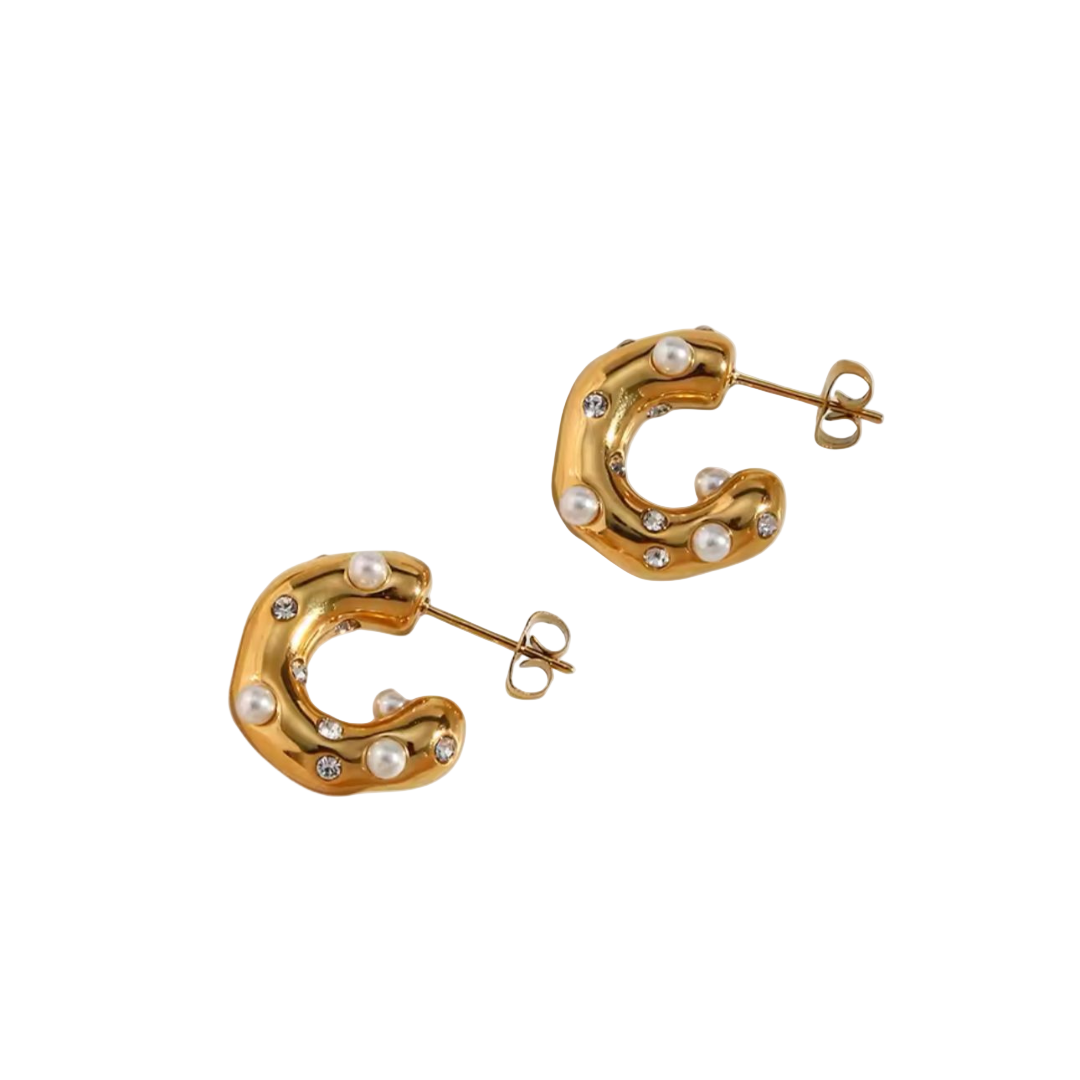 A pair of 18k gold-plated stainless steel hoop earrings with curved design and embellished with pearls and shimmering accents.