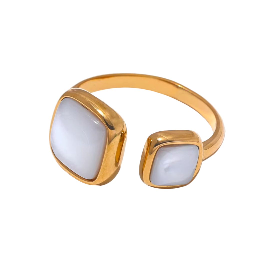 An adjustable stainless steel 18k gold-plated gold ring with white square shells on a white background.