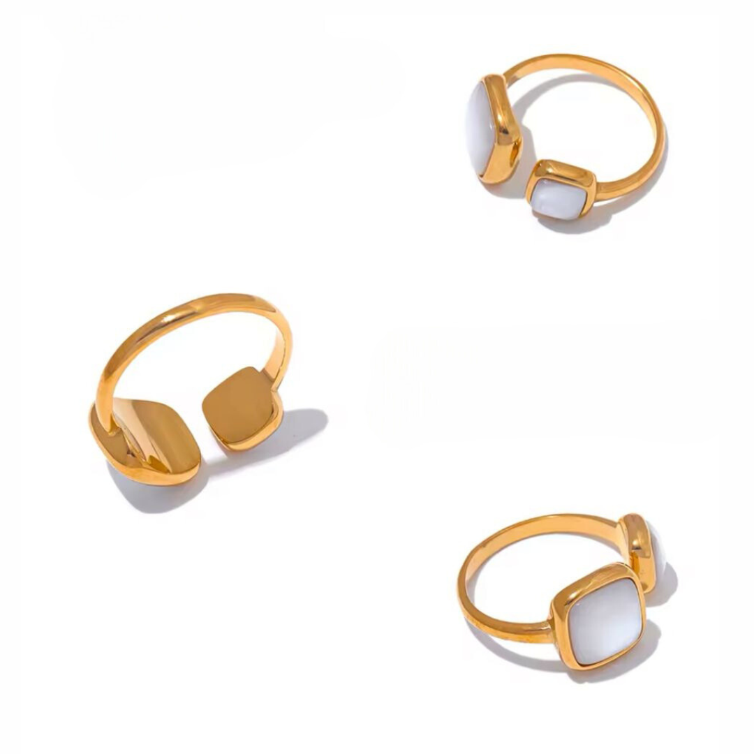 A collection of adjustable stainless steel 18k gold-plated gold rings with white square shells on a white background.