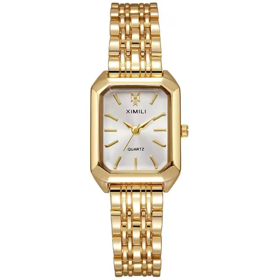 Gold wristwatch with a white face on a white background