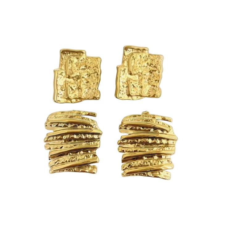 Pair of gold textured earrings on a white background