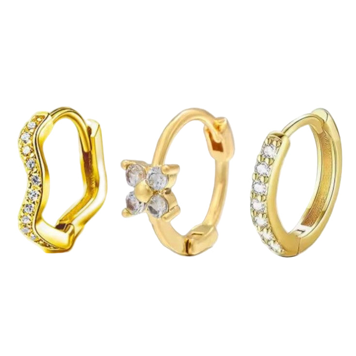 Set of 3 Huggie Hoop Earrings in Gold on a white background