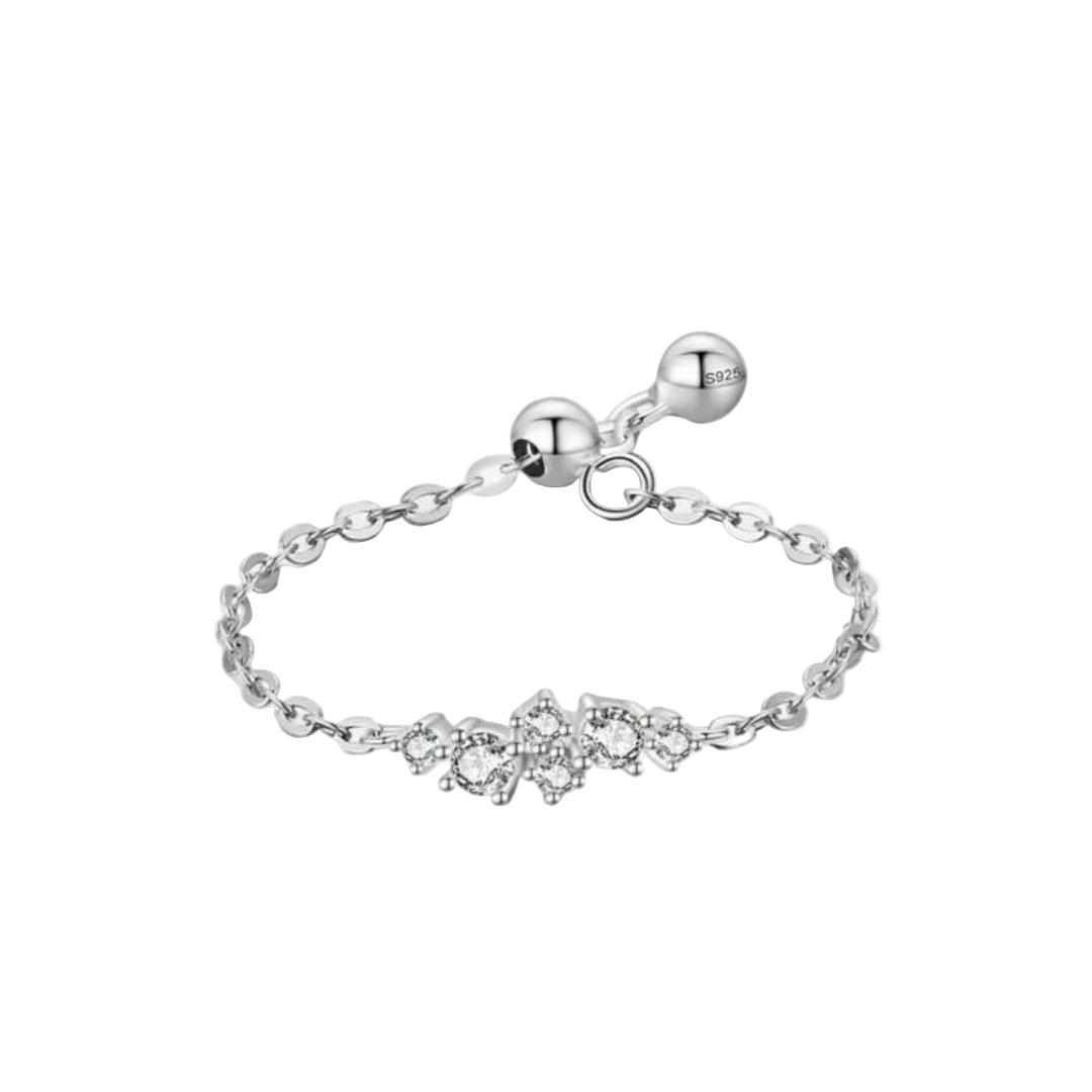 An adjustable sterling silver ring with a chain design and a central spherical embellishment.
