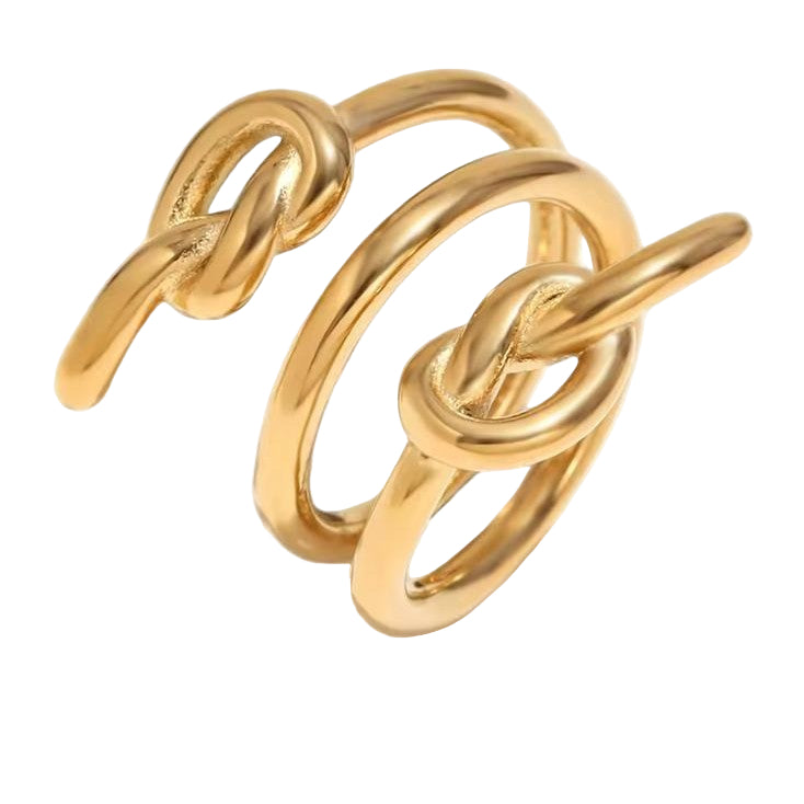 Gold three-knot-shaped ring on a white background