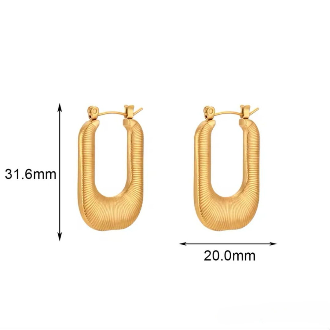 A pair of gold-plated stainless steel hoop earrings on a white background.