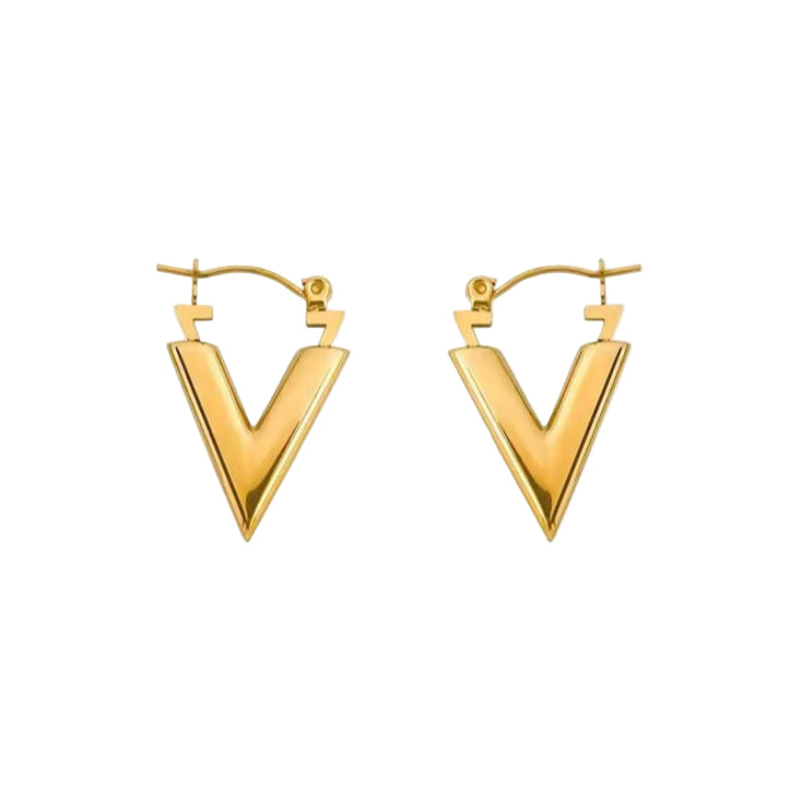 Gold V-shaped hoop earrings on a white background