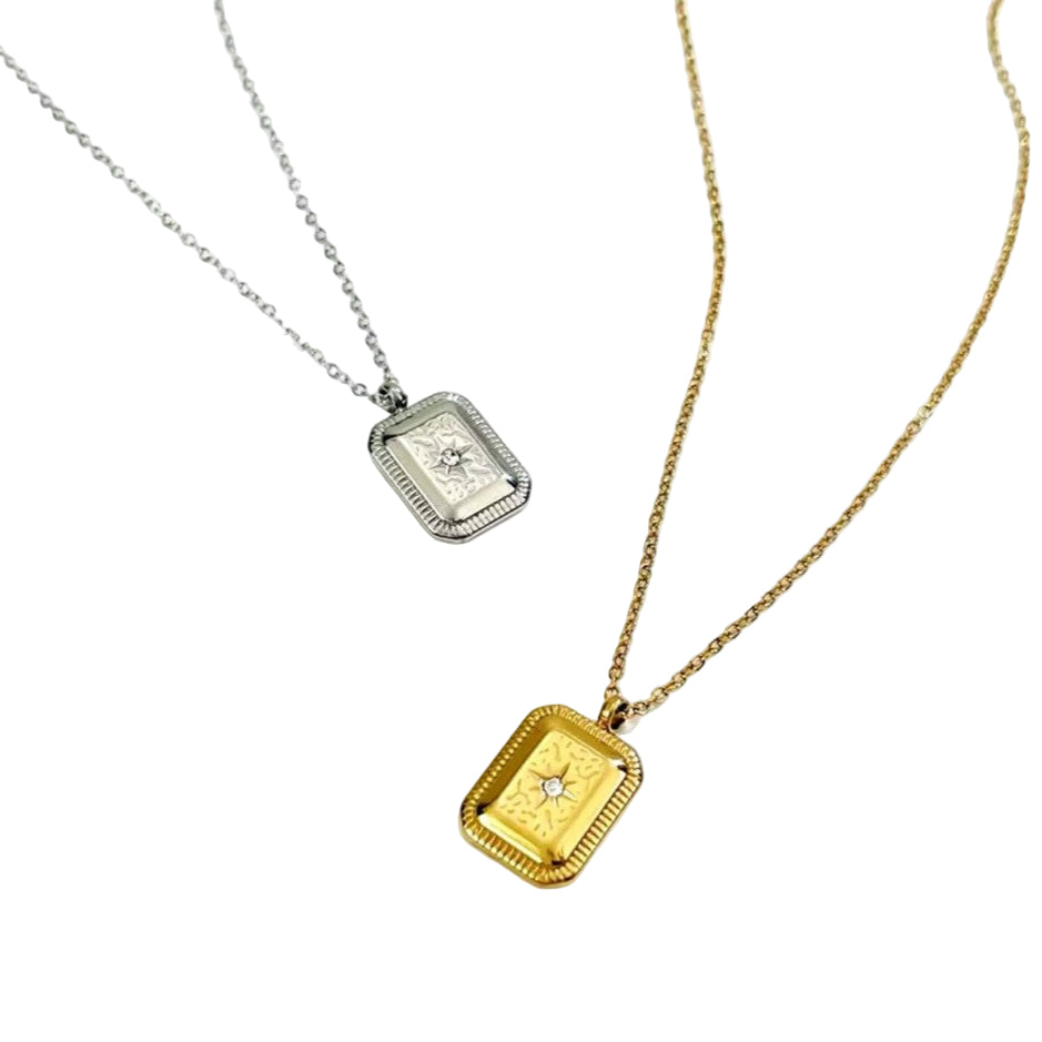 Two vintage geometric charm necklaces with titanium steel square pendants, one plated in gold and the other in silver, displayed against a white background.