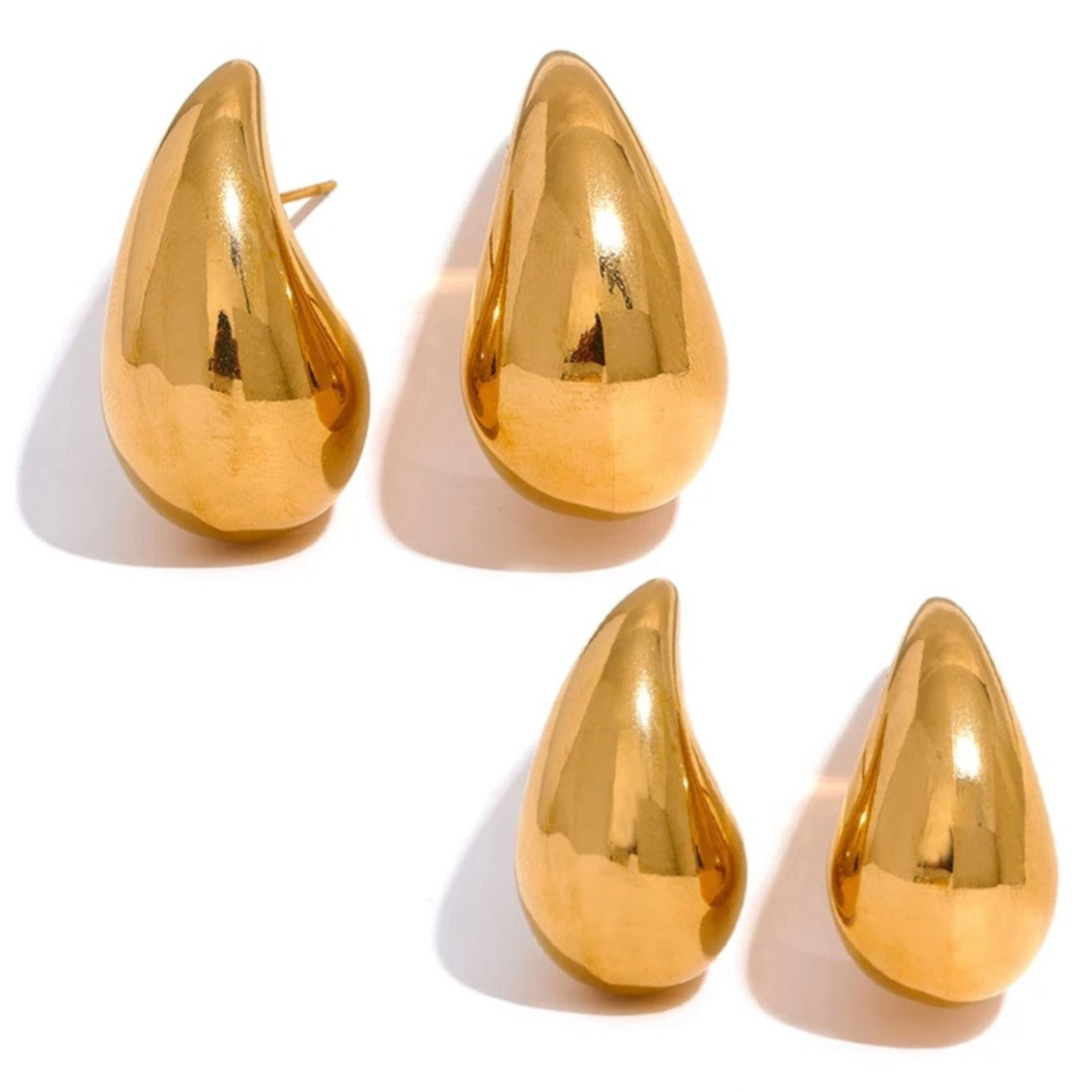 A set of gold-colored drop earrings with a glossy finish.