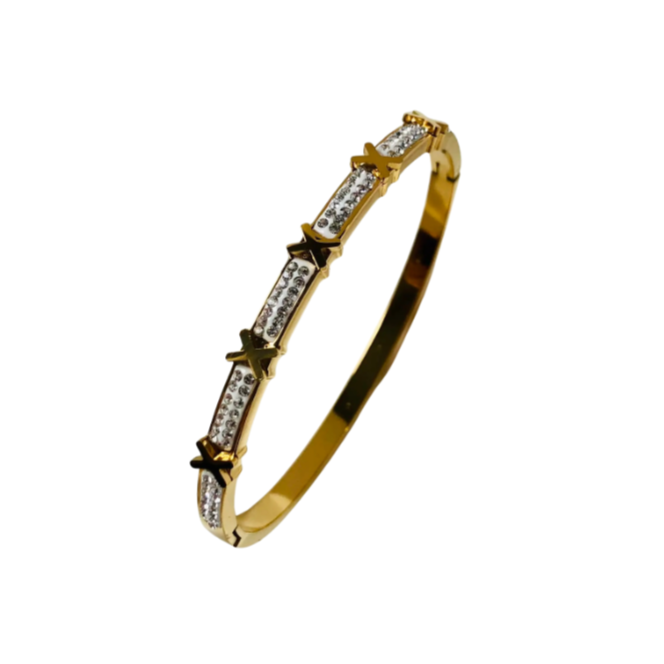 A gold stainless steel bangle bracelet with intricate designs and sparkling accents.