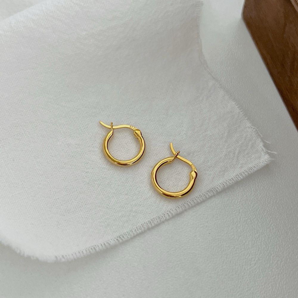 A pair of gold hoop earrings made of 925 sterling silver with 18k gold plating, displayed against a white background.
