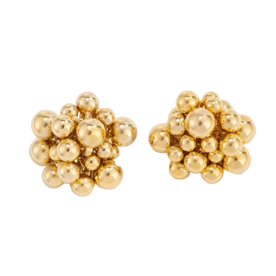 A pair of gold-colored earrings with a honeycomb pattern.
