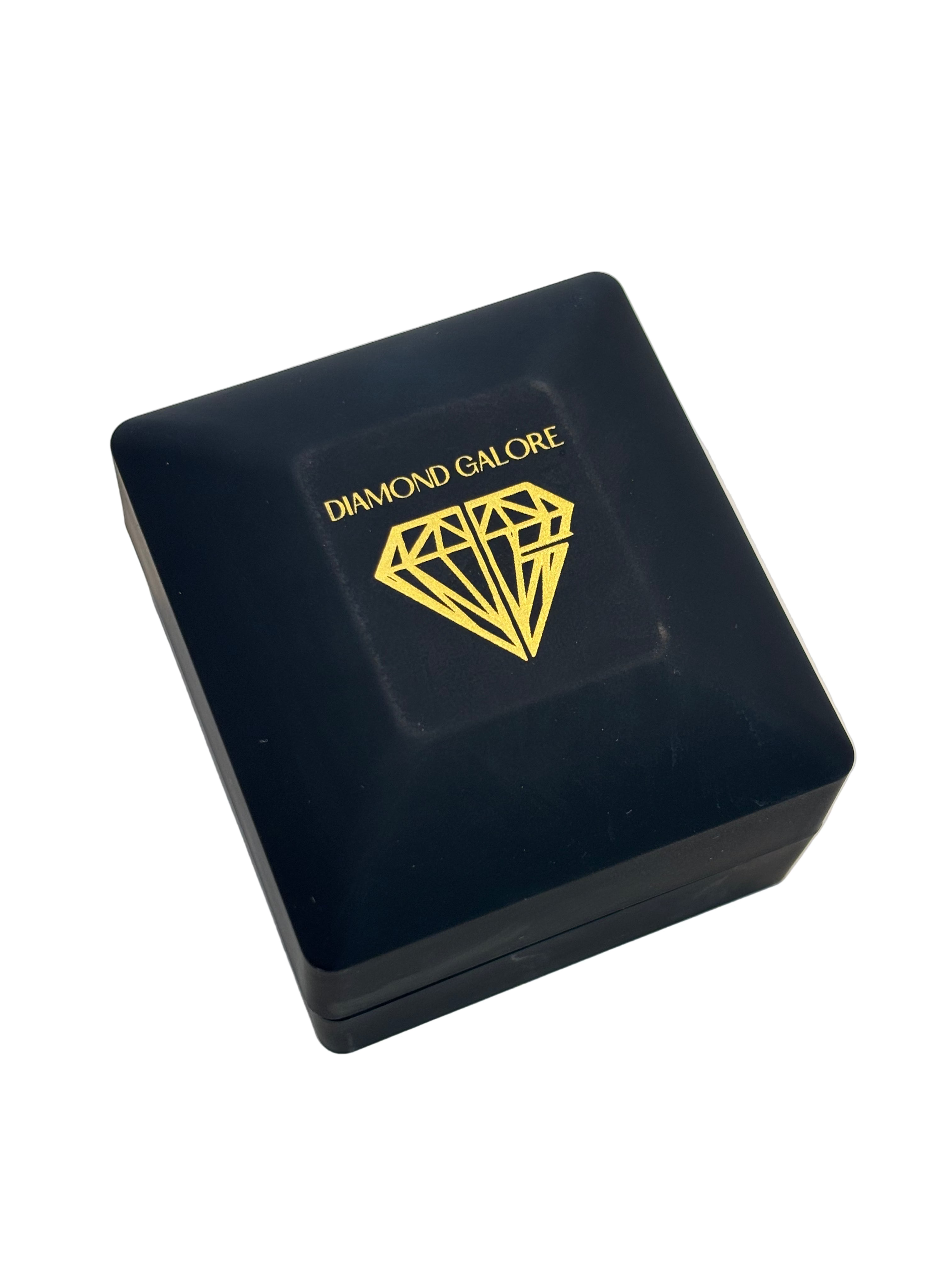 A black ring box with the brand name 'Diamond Galore' written in gold. The box is closed and positioned on a white surface.