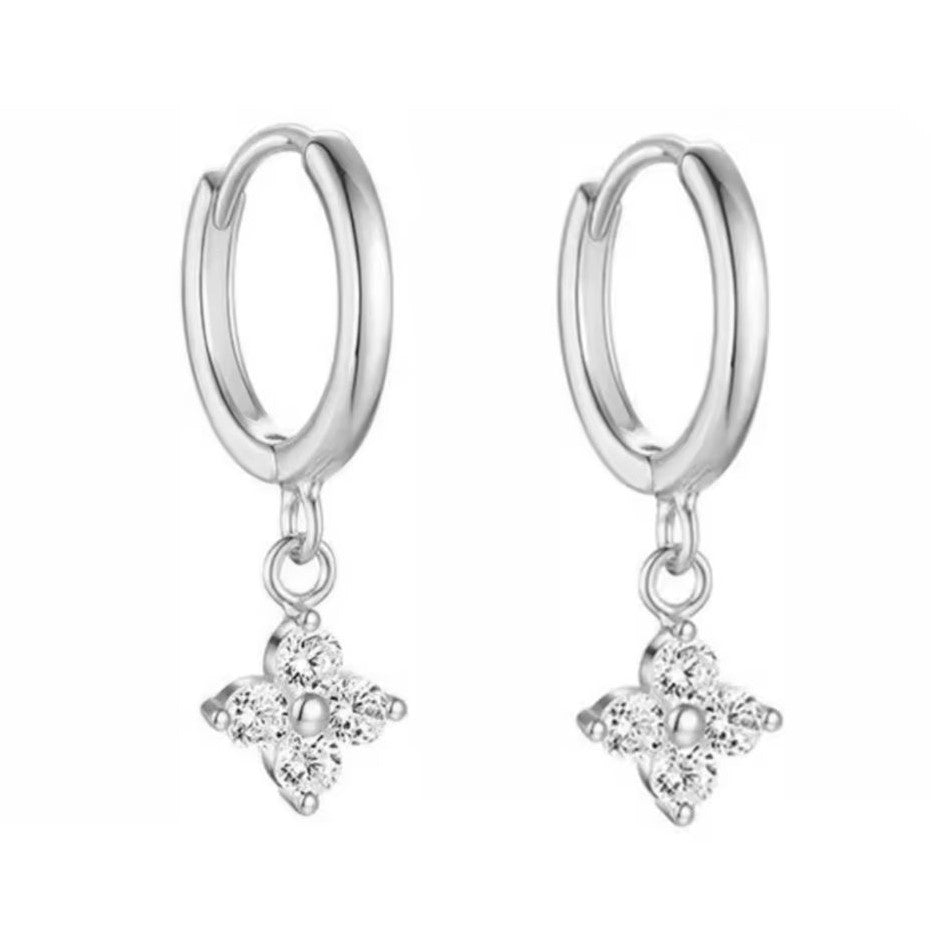 A pair of silver-colored hoop earrings with a floral petal drop design, crafted from stainless steel.