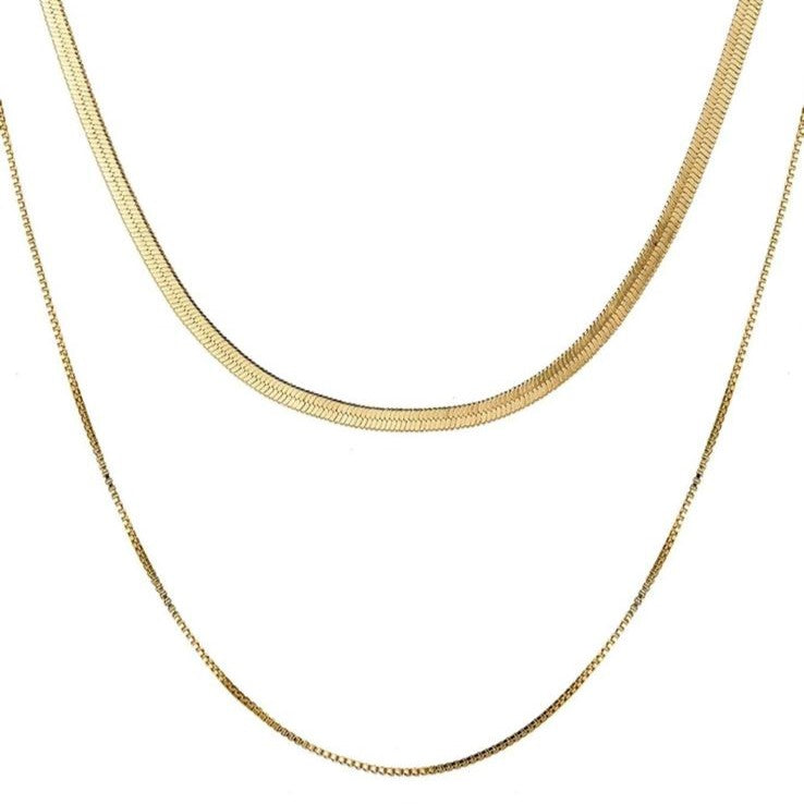 Two layered flat snake chain necklaces in gold tone, displayed against a white background.
