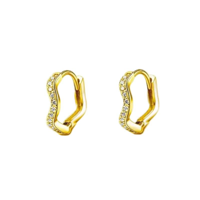A pair of gold-colored huggie hoop earrings with a wave pattern design, made from stainless steel.