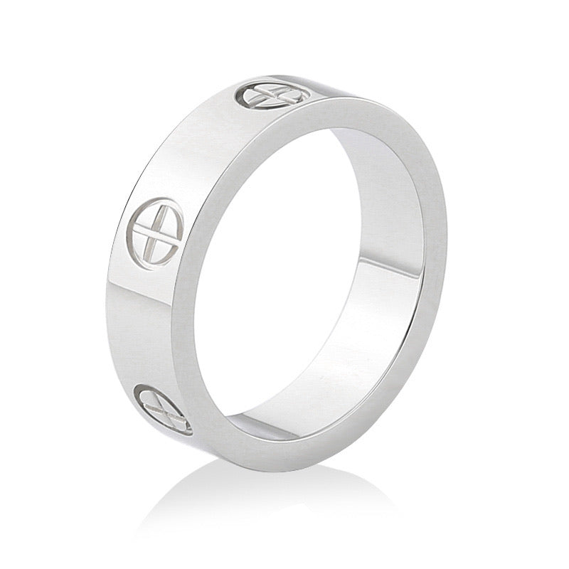 A silver-colored stainless steel ring with a plus design on white background.