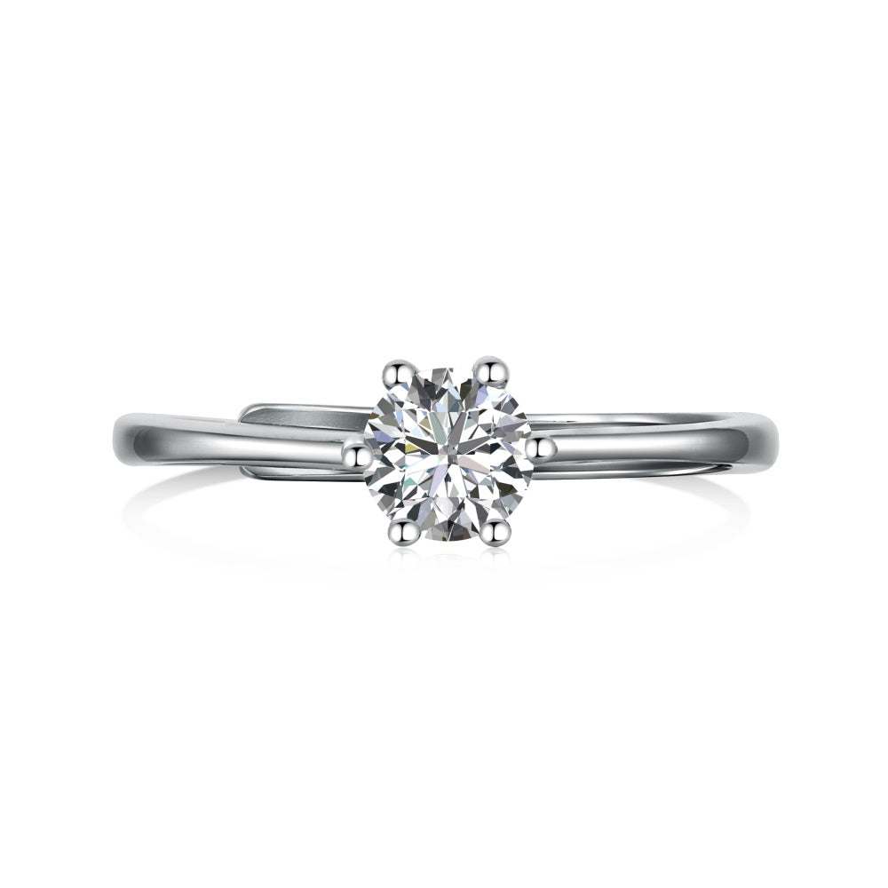 A silver-colored adjustable ring featuring a round 0.5 ct zirconia main stone set in a silver-colored band.