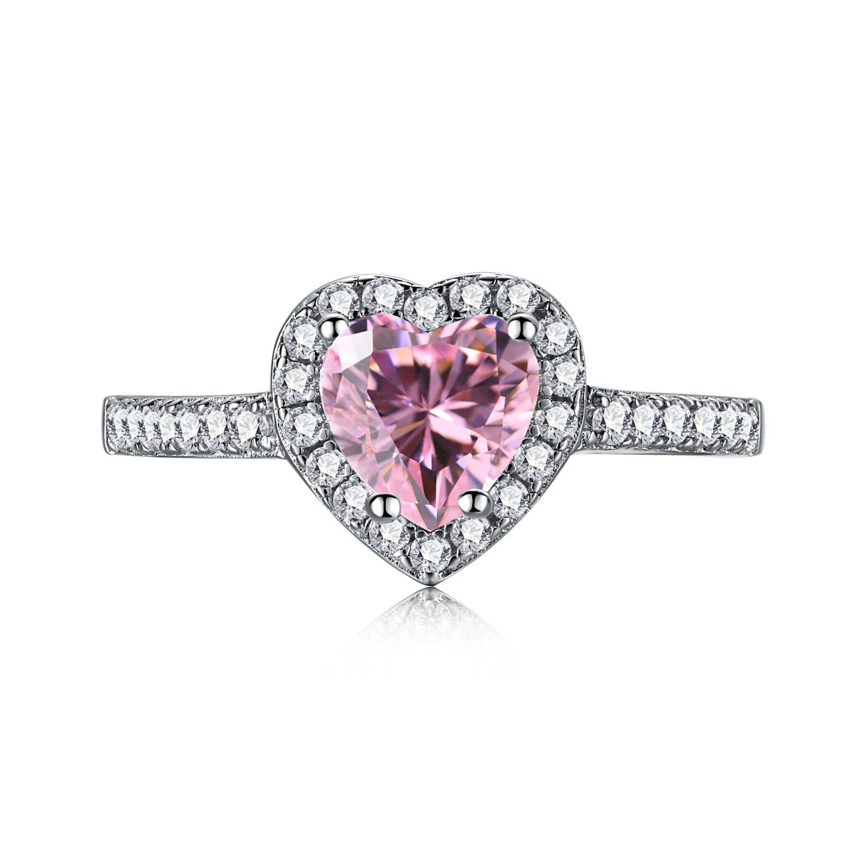 A heart-shaped pink cubic zirconia ring with a halo of smaller clear crystals on a silver band.