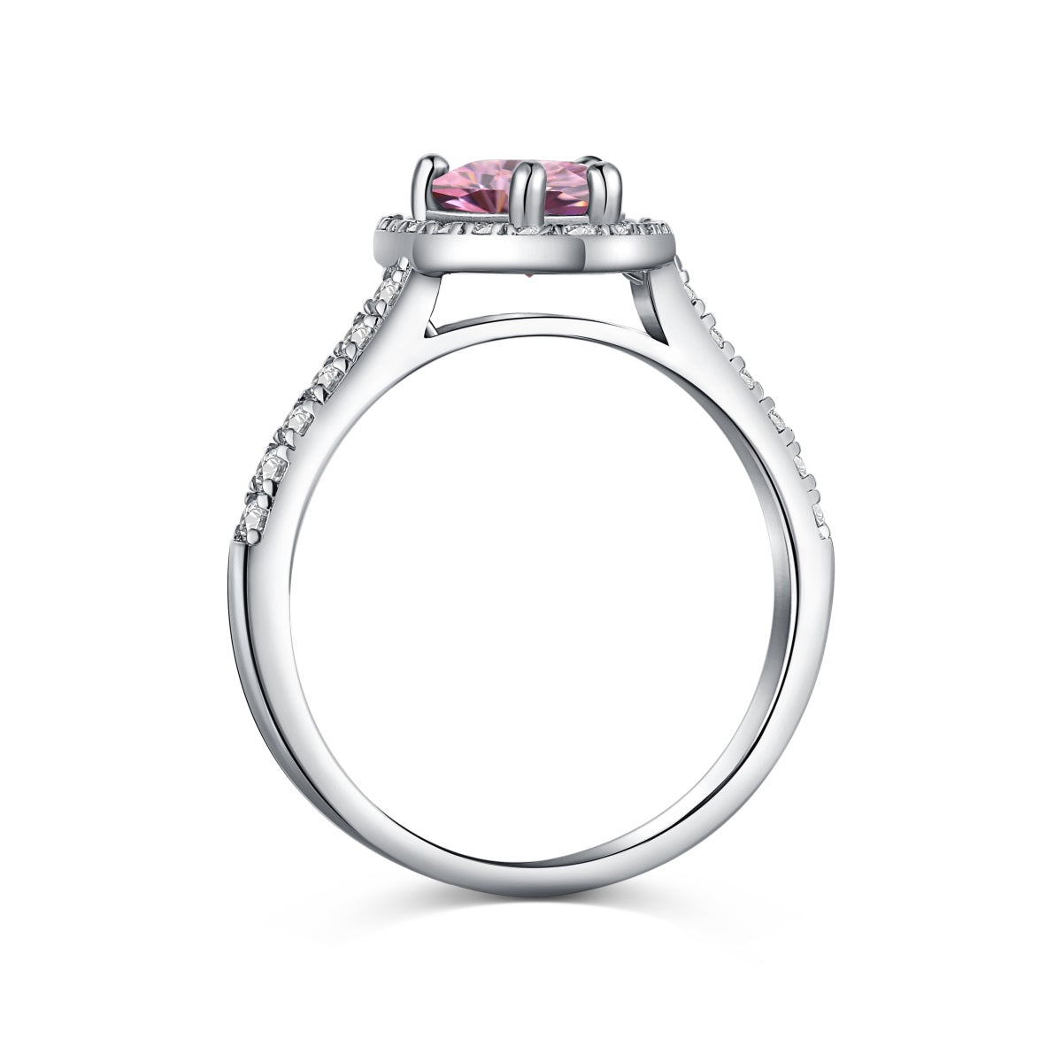 A heart-shaped pink cubic zirconia ring with a halo of smaller clear crystals on a silver band.