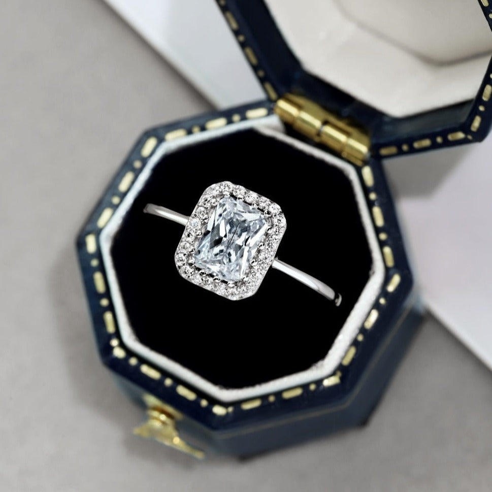 A radiant cut alia ring with a main stone size of 5mm*7mm, set in a white gold band.