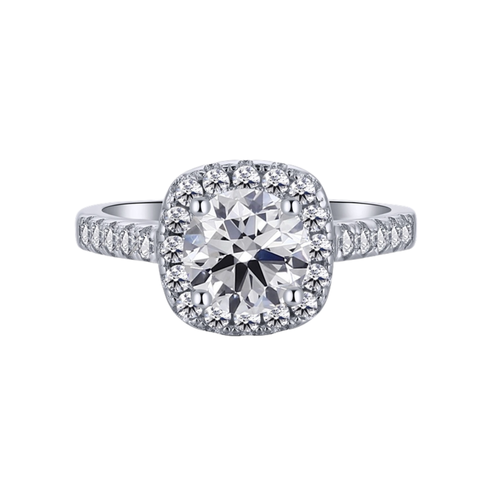 An elegant sterling silver ring featuring a round clear zircon stone with smaller clear stones around it, showcasing an inspired design.