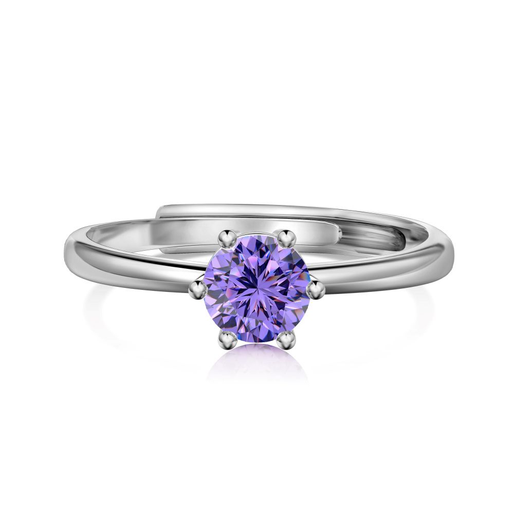 An adjustable ring with a round purple birthstone set in a silver-colored band.