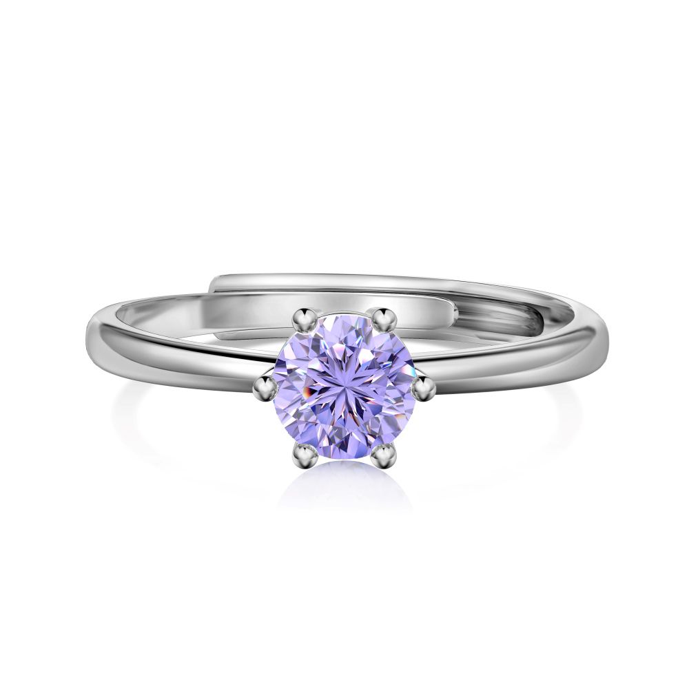 An adjustable birthstone ring with a purple gemstone, set in a silver band, presented on a white background.