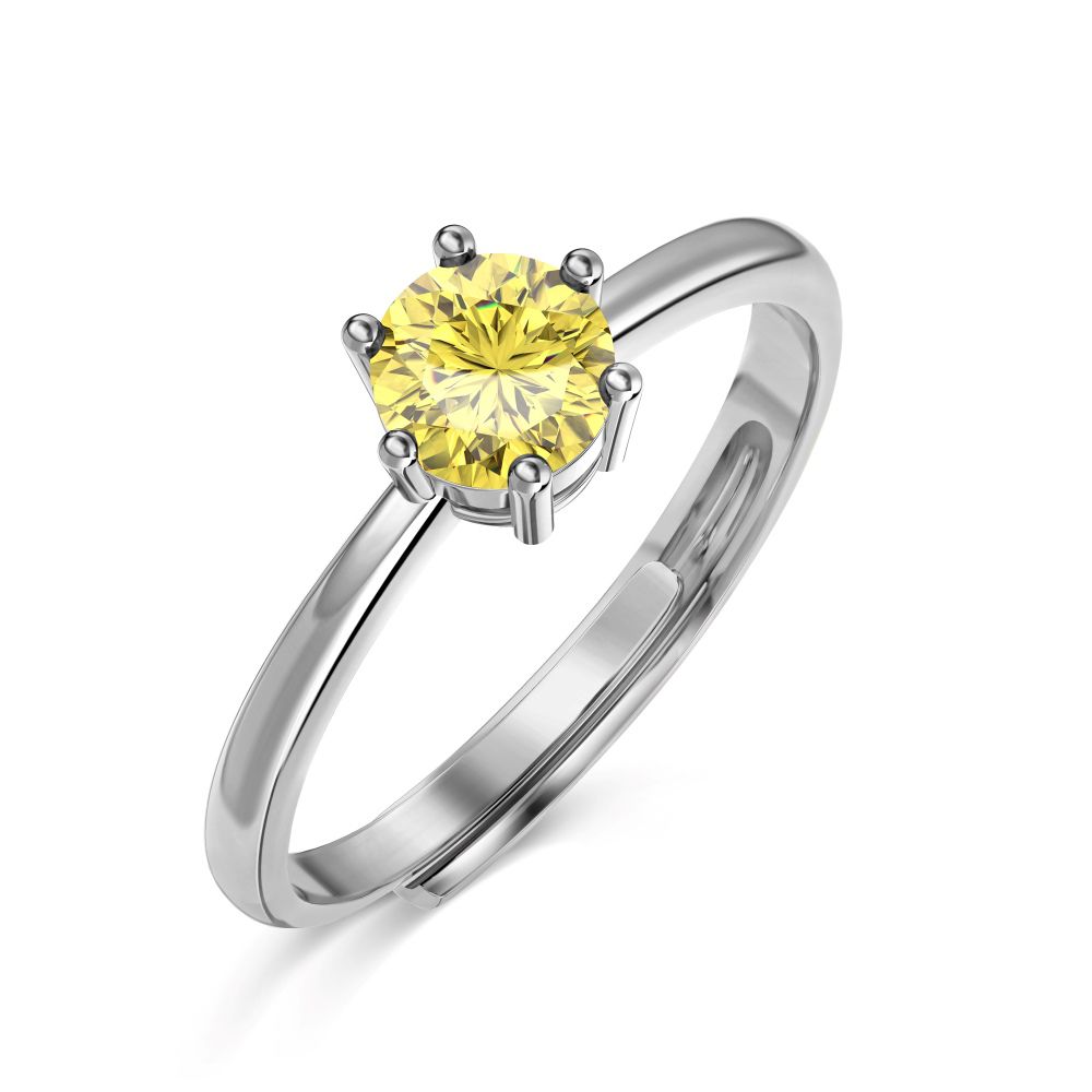 An adjustable ring with a round yellow birthstone set in a silver-colored band.