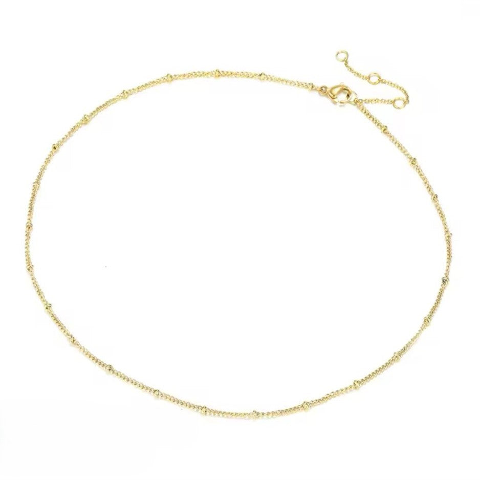 A 14K gold plated stainless steel chain necklace with a length of 38 + 5cm, displaying a radiant gold finish.