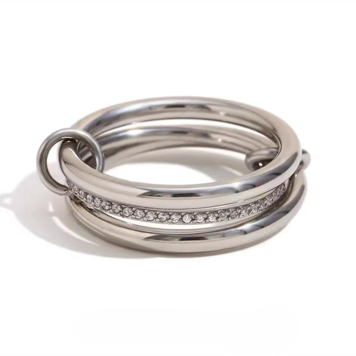 A ring with set of three interlocking rings with silver colors, crafted from 18K gold plated stainless steel.