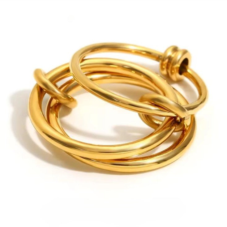 A ring with set of three interlocking rings with gold color, crafted from 18K gold plated stainless steel.