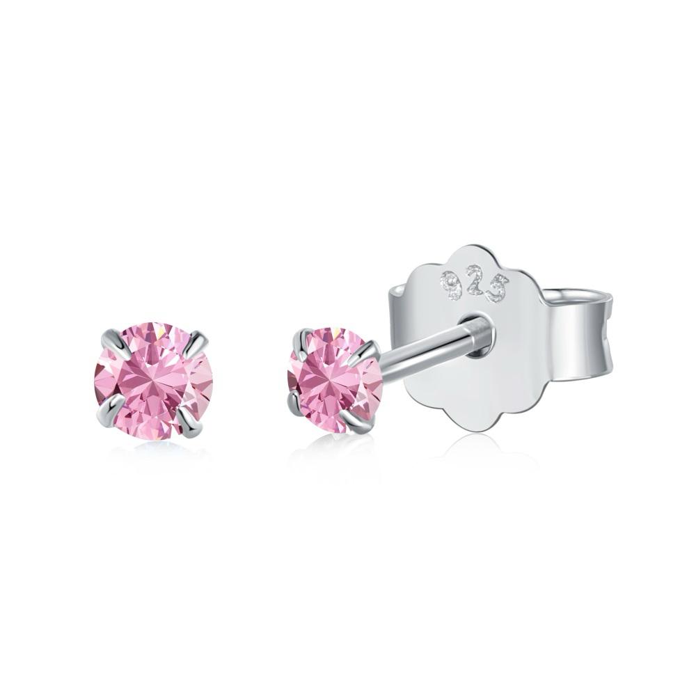 A pair of Luxe Stud Earrings with pink stones on a white background.