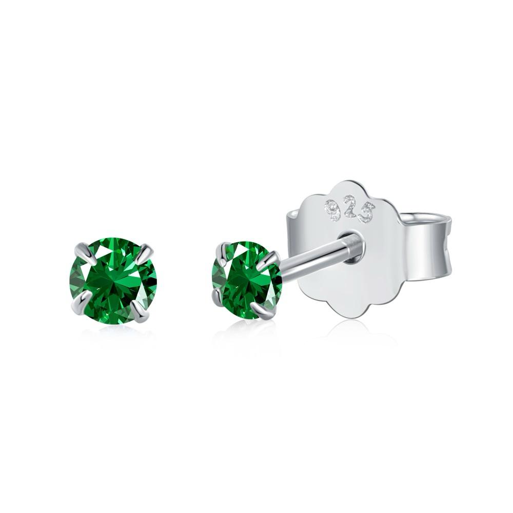 A pair of Luxe Stud Earrings with green stones on a white background.