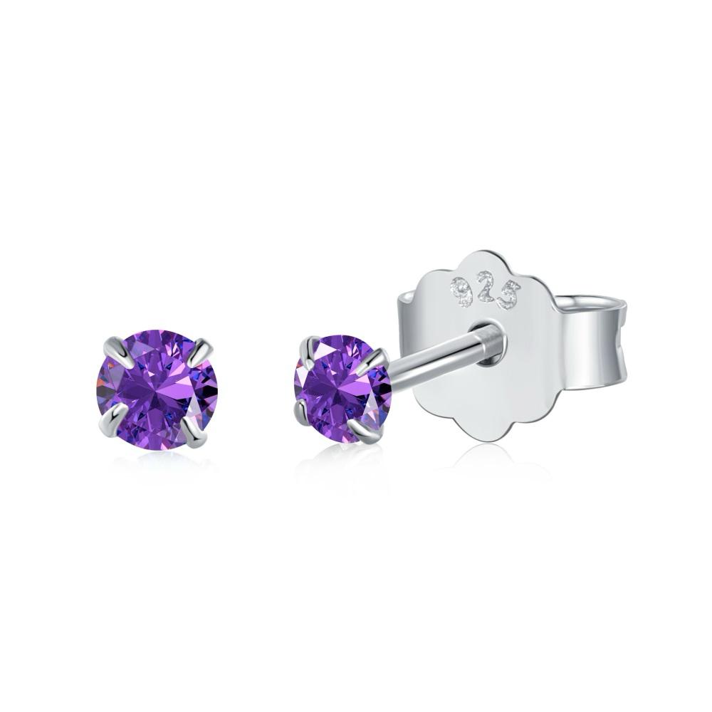 A pair of Luxe Stud Earrings with purple stones on a white background.