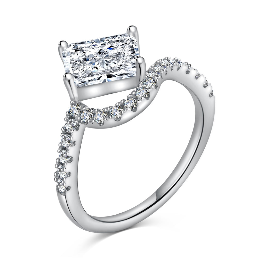 A sterling silver ring featuring a main stone white-color, shaped as a rectangle and set with smaller round diamonds.