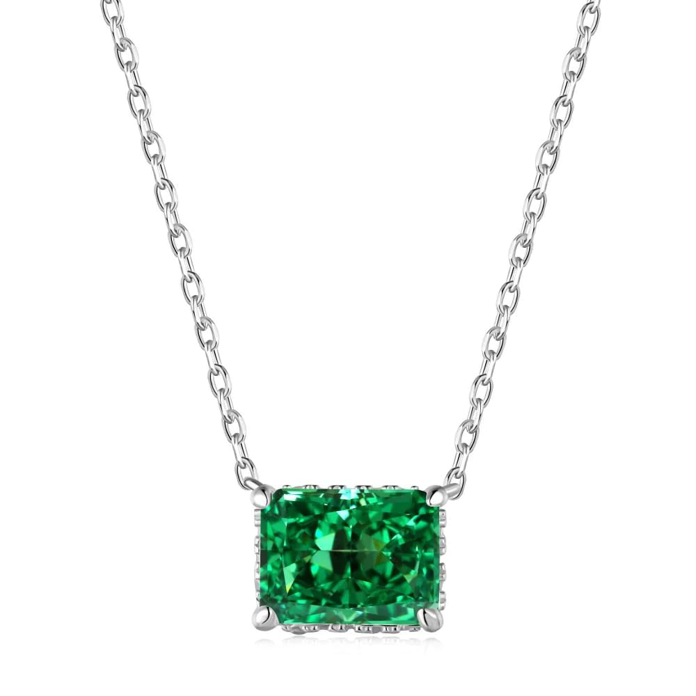A rhodium plated necklace with a rectangle radiant cut 8A CZ main green stone on a chain.